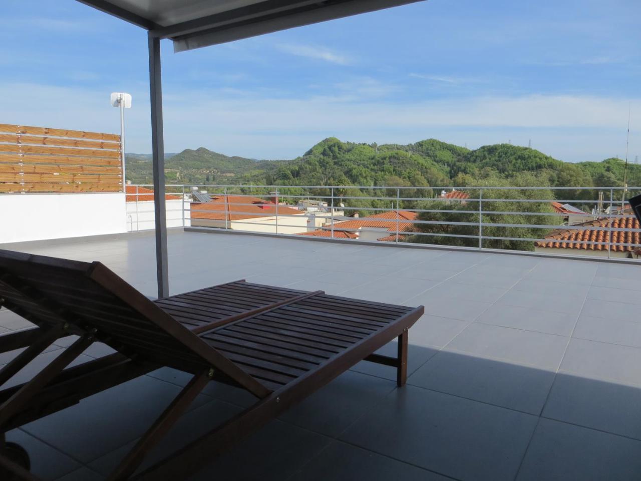Leonidaion Guesthouse أولمبيا المظهر الخارجي الصورة A roof terrace in Spain